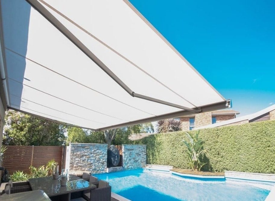 Folding Arm Awning Providing Shade Over the Pool Area — Window Coverings in Bundaberg, QLD